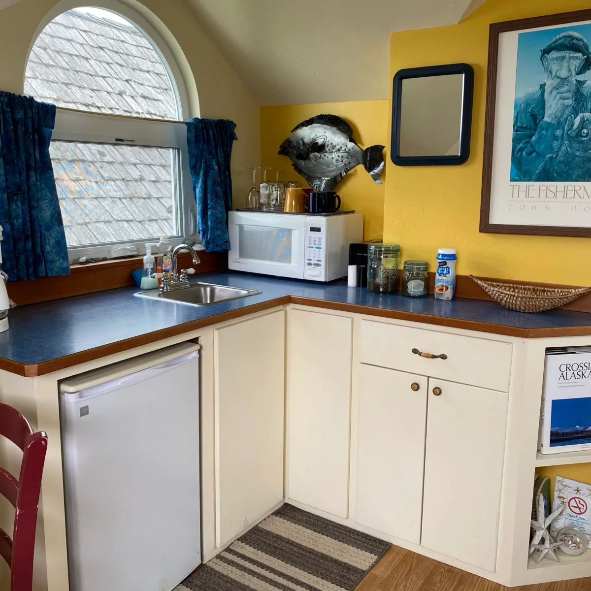 a kitchen with a stove top oven sitting inside of a room