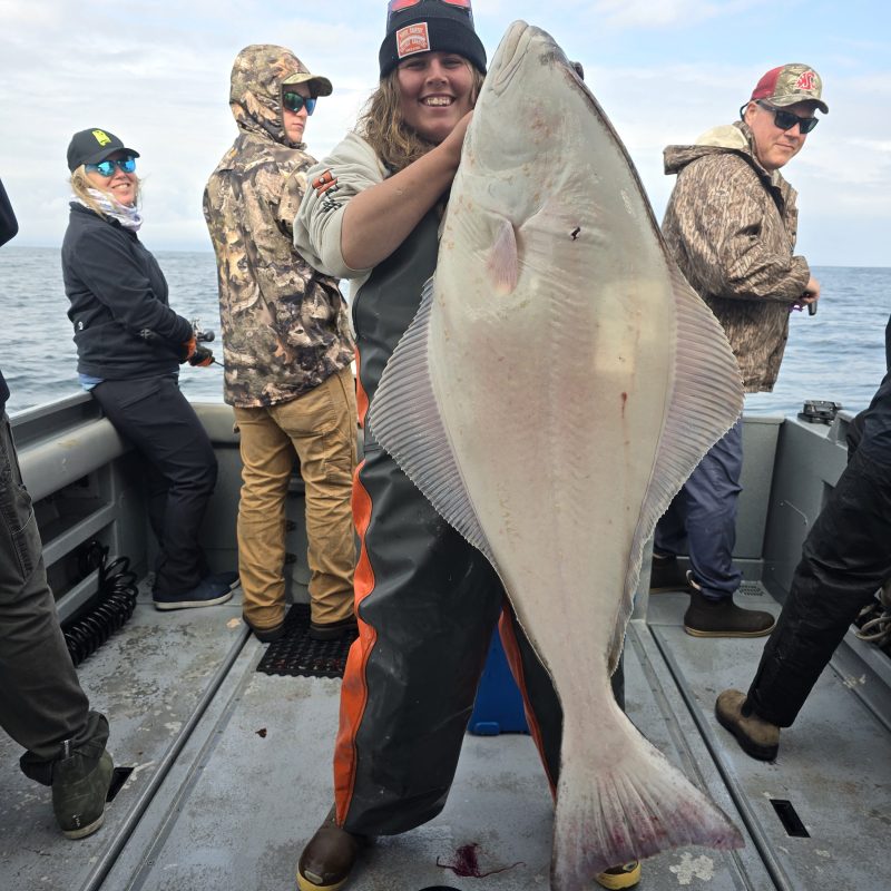 a group of people standing around each other