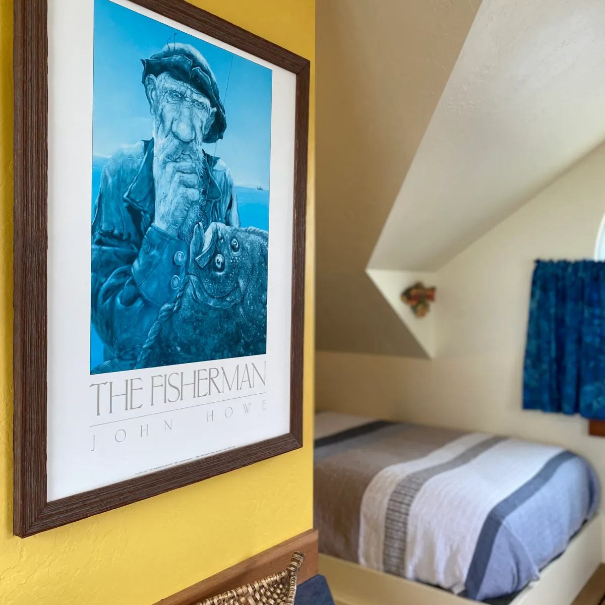 a bedroom with a bed and desk in a room