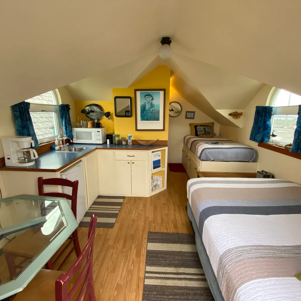 a bedroom with a bed and desk in a room