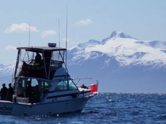 a small boat in a large body of water
