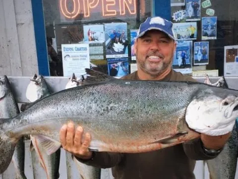 a man holding a fish