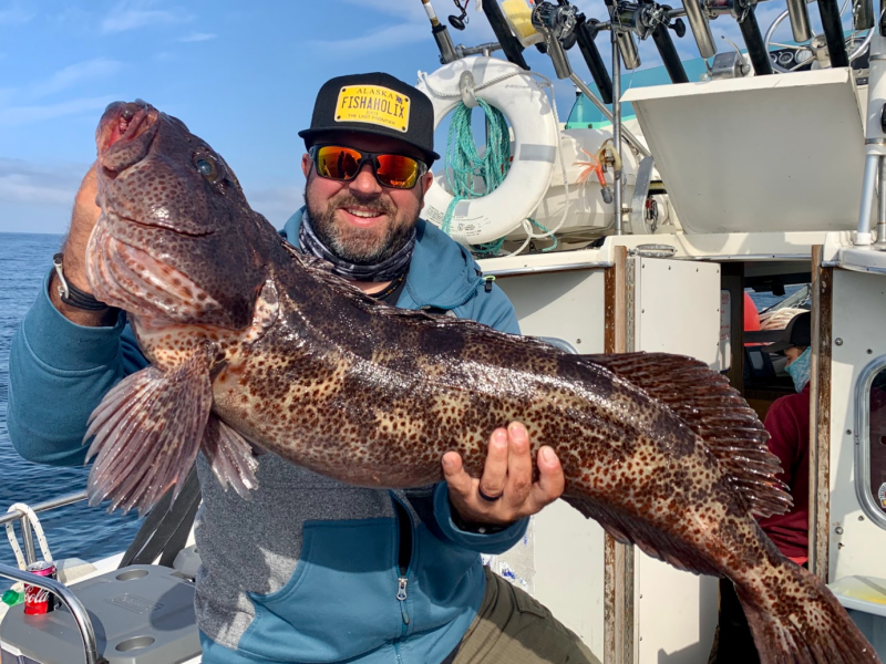 a person holding a fish