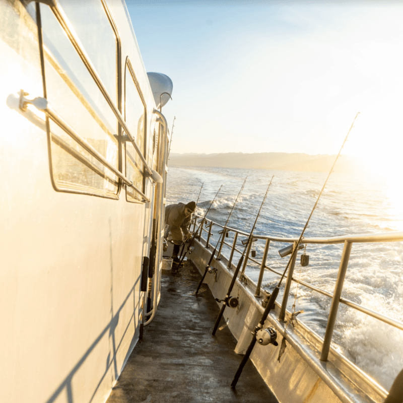 a boat is docked next to a body of water