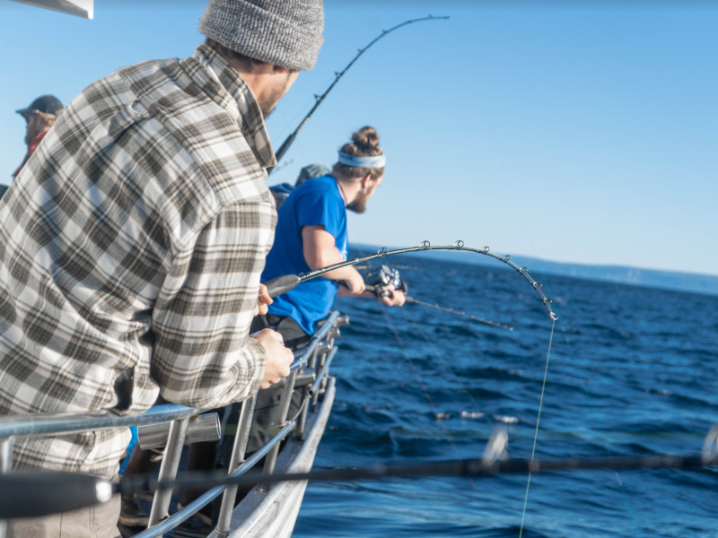 a man riding on the back of a boat