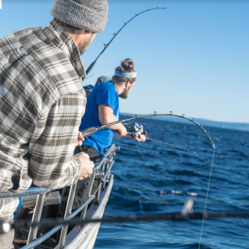 a man riding on the back of a boat
