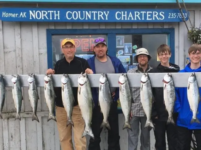 a group of people standing in front of a fish