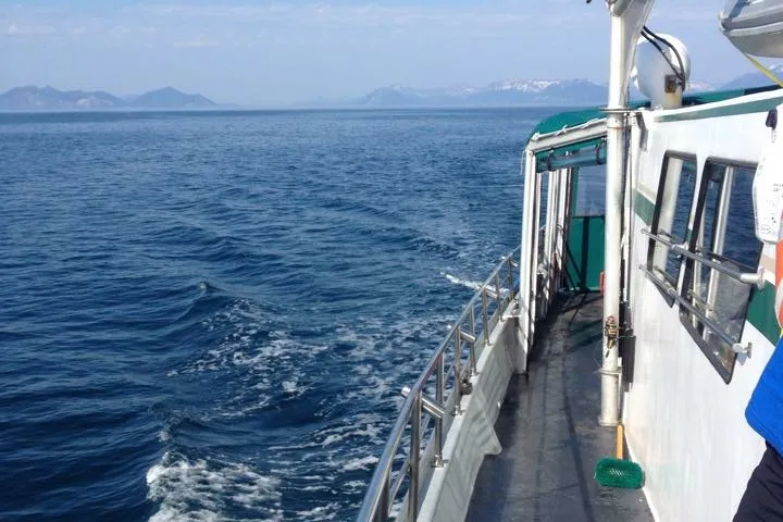 a small boat in a large body of water