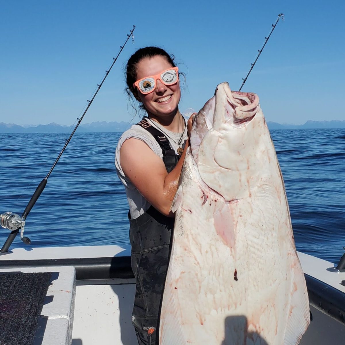 a person holding a fish in the water