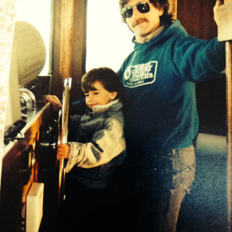 a person standing in front of a mirror posing for the camera